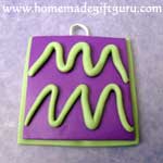 Attach Aquarius symbl to charm base and press down gently...