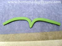 Trim bottom into a point and finish molding aries symbol...