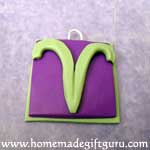 Attach Aries symbl to charm base and press down gently...
