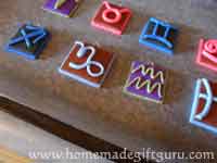 Bake polymer clay key chain charms as directed by manufacturer...