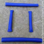 Roll out polymer clay logs and cut in four pieces...