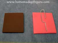 Press paper clip down gently and sandwich between key chain layers...