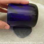 Rolling polymer clay for Leo symbol art charm...
