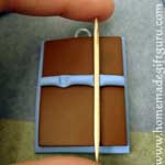 A tooth pick can be used to gently flatten clay where it will need to overlap for Pisces symbol...