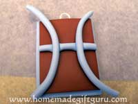 Continue to mold coil into Pisces symbol, trim excess from end...