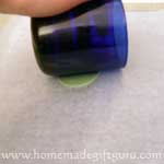 Flatten a ball of polymer clay between two sheets of wax paper...