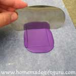 Cut the top layer of the base of your homemade Aries key chain...