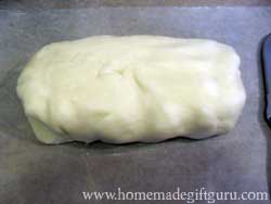 Once, warm but touchable, knead dough into a loaf...