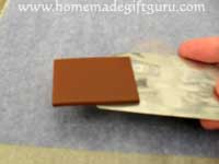 Cut the top layer of the base of your homemade Pisces key chain...