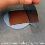 Cut the bottom key chain layer slightly larger than the top...