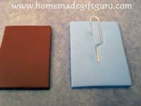 Press paper clip down gently and sandwich between key chain layers...