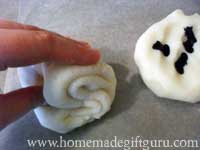 To knead dough, fold, puch and squeeze until dough is all one color...