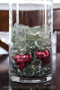 Chocolate hearts snuck in amongst the glass beads is a cute candy bouquet idea...