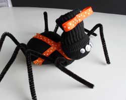 Dress your sock spider up however you choose. Use ribbon, flannel for a scarf or keep it simple. These guys will be cute no matter what.