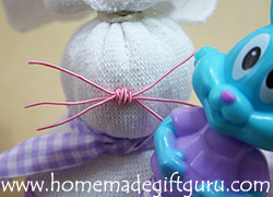 Sock Craft Tutorial: Memory wire makes a cute nose with whiskers.