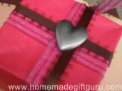 Heart charm decorates homemade origami Masu box.
